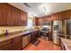 Stylish kitchen with stainless steel appliances, wood cabinets, and laminate countertops at 4872 Nature Trl, Austell, GA 30106