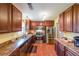 Eat-in kitchen with stainless steel appliances, wood cabinets, and laminate countertops at 4872 Nature Trl, Austell, GA 30106