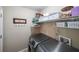 Convenient laundry area with modern front-load washer and dryer, plus storage shelves at 4872 Nature Trl, Austell, GA 30106