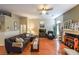 Comfortable living area with an open floor plan, stylish hardwood floors, and a cozy fireplace at 4872 Nature Trl, Austell, GA 30106