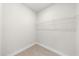 Walk-in closet with wire shelving and carpeted floor at 1381 Wallace Walk, Atlanta, GA 30316