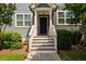 Inviting townhouse entryway showcasing stairs and a classic door design, enhancing curb appeal at 1381 Wallace Walk, Atlanta, GA 30316