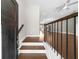 Inviting entryway featuring hardwood floors, a modern railing, and an open view to the living space at 1381 Wallace Walk, Atlanta, GA 30316