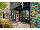 Charming commercial building featuring a unique colorful brick design and outdoor seating area, adding vibrant appeal at 1381 Wallace Walk, Atlanta, GA 30316