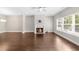 Bright living room with fireplace, large window, and hardwood floors at 1381 Wallace Walk, Atlanta, GA 30316