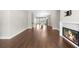 Open concept living room features a fireplace and hardwood floors at 1381 Wallace Walk, Atlanta, GA 30316