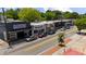 Aerial view showcases a commercial district with storefronts and street parking, highlighting location and accessibility at 1381 Wallace Walk, Atlanta, GA 30316