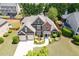 Stunning aerial view of the home showcasing its well-manicured lawn, charming curb appeal and proximity to the neighborhood at 1563 Country Wood Dr, Hoschton, GA 30548