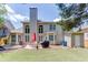 Spacious backyard featuring lush lawn, a patio with outdoor furniture, and mature trees for added privacy at 1563 Country Wood Dr, Hoschton, GA 30548