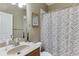 Bathroom featuring a vanity with a sink, a toilet, and a shower with a decorative curtain at 1563 Country Wood Dr, Hoschton, GA 30548