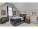 Upstairs bedroom featuring carpet, decor, natural light, a sloped ceiling, and comfortable furnishings at 1563 Country Wood Dr, Hoschton, GA 30548