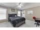 Nicely decorated bedroom with black furnishings, soft carpet, and a well-lit desk area at 1563 Country Wood Dr, Hoschton, GA 30548