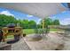 Inviting backyard patio with overhead shade, barbecue, and outdoor seating, perfect for relaxation and entertaining at 2470 Day Break Way, Dacula, GA 30019