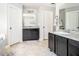 Dual vanities in bathroom with tile flooring and neutral paint at 2470 Day Break Way, Dacula, GA 30019