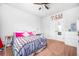 Bright bedroom featuring a comfortable bed, soft carpet, and access to closet space at 2470 Day Break Way, Dacula, GA 30019
