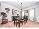 Bright dining room with traditional decor, large windows, and a stylish chandelier at 2470 Day Break Way, Dacula, GA 30019