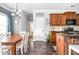 Cozy dining room next to a kitchen featuring wooden cabinets, granite countertops, and stainless steel appliances at 2470 Day Break Way, Dacula, GA 30019