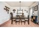 Charming dining room features neutral paint, a chandelier, and decorative accents at 2470 Day Break Way, Dacula, GA 30019