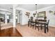 Elegant dining room with dark wood table and chairs and neutral paint scheme at 2470 Day Break Way, Dacula, GA 30019