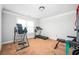 Well-equipped exercise room featuring a treadmill, inversion table, and weight bench at 2470 Day Break Way, Dacula, GA 30019
