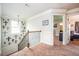 Hallway near a staircase with a dark metal railing and view of a bedroom at 2470 Day Break Way, Dacula, GA 30019