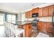 Spacious kitchen island features barstool seating, modern appliances, and wood cabinets at 2470 Day Break Way, Dacula, GA 30019