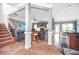 Spacious living area with staircase, neutral walls, and seamless flow to the kitchen at 2470 Day Break Way, Dacula, GA 30019