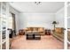 Bright living room featuring neutral paint, plush carpet, comfortable seating and natural light at 2470 Day Break Way, Dacula, GA 30019