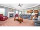 Comfortable living area with a fireplace and seamless transition into a well-appointed kitchen at 2470 Day Break Way, Dacula, GA 30019