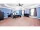 Spacious main bedroom featuring trey ceilings, dark furniture, large windows, and carpet at 2470 Day Break Way, Dacula, GA 30019