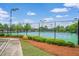 Well-maintained tennis courts surrounded by lush landscaping create a pleasant community recreational area at 2470 Day Break Way, Dacula, GA 30019