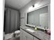 Bathroom featuring granite countertop, tile floor, and shower with curtain at 2506 Monta Vista Way, Hoschton, GA 30548