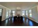 Open dining room with fireplace and multiple windows for ample natural light at 2506 Monta Vista Way, Hoschton, GA 30548