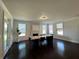 Dining room showcasing a large table, fireplace, windows, and access to the outdoor patio at 2506 Monta Vista Way, Hoschton, GA 30548