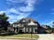 Beautiful brick home with well-kept lawn, attached garage, and long driveway, offering ample parking space at 2506 Monta Vista Way, Hoschton, GA 30548