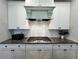 Stylish kitchen featuring white cabinets, granite countertops, and a white subway tile backsplash, great for cooking at 2506 Monta Vista Way, Hoschton, GA 30548