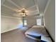 Spacious main bedroom featuring trey ceiling, large windows and plush carpeting at 2506 Monta Vista Way, Hoschton, GA 30548