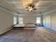 Bright main bedroom featuring trey ceiling, large windows and plush carpeting at 2506 Monta Vista Way, Hoschton, GA 30548