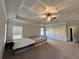 Bright main bedroom featuring trey ceiling, large windows and plush carpeting at 2506 Monta Vista Way, Hoschton, GA 30548