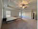 Generous main bedroom with a trey ceiling, large windows and neutral colored walls at 2506 Monta Vista Way, Hoschton, GA 30548
