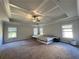 Spacious main bedroom featuring trey ceiling, large windows and plush carpeting at 2506 Monta Vista Way, Hoschton, GA 30548