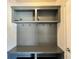 Gray mudroom features a built-in bench, storage and hooks for organization at 2506 Monta Vista Way, Hoschton, GA 30548