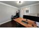 Office with hardwood floors, natural light from the windows and sleek, modern desk at 2506 Monta Vista Way, Hoschton, GA 30548