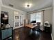 Office with hardwood floors, natural light from windows and a sleek, modern desk at 2506 Monta Vista Way, Hoschton, GA 30548