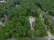 Aerial view of a secluded home nestled in a lush, green forest setting at 2700 Sam Nelson Rd, Canton, GA 30114