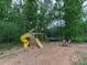 Backyard with a colorful playset and trampoline, great for outdoor Gathering fun at 2700 Sam Nelson Rd, Canton, GA 30114