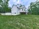 Lush backyard featuring a walkout basement and deck, perfect for outdoor entertaining at 2700 Sam Nelson Rd, Canton, GA 30114