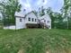 Scenic view of the back exterior of the home with a deck and ample yard space at 2700 Sam Nelson Rd, Canton, GA 30114
