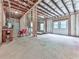Unfinished basement space featuring exposed insulation, concrete floors, and a door to the backyard at 2700 Sam Nelson Rd, Canton, GA 30114