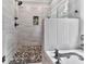 Shower with grey wall tiles and a decorative mosaic tile inset at 2700 Sam Nelson Rd, Canton, GA 30114